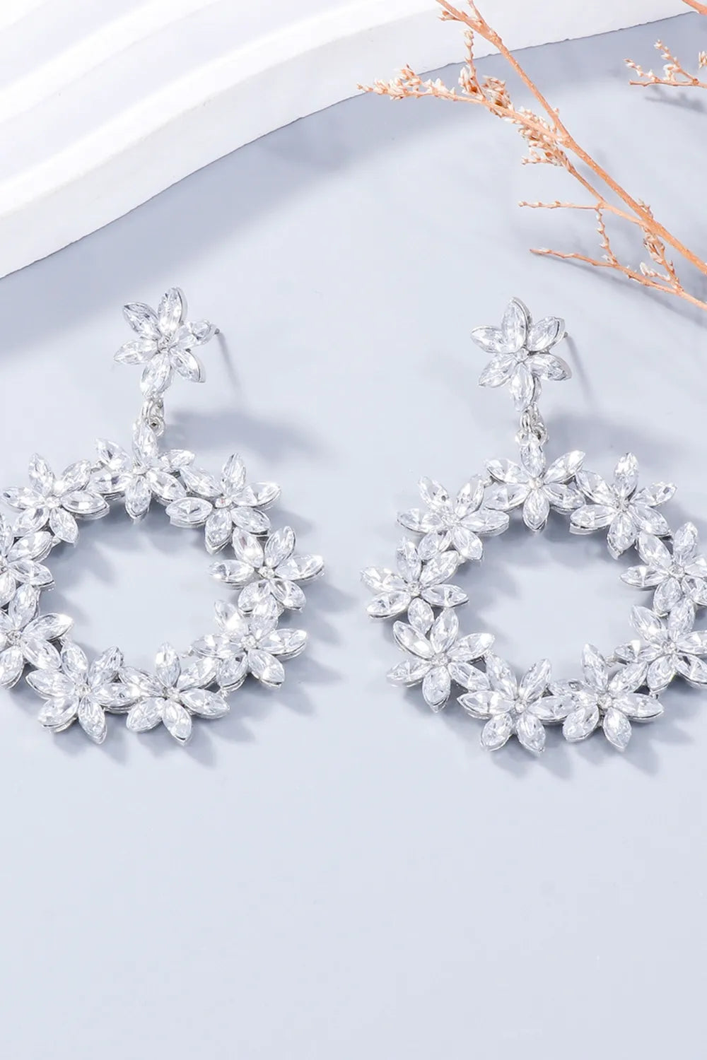 Silver floral halo drop earrings with crystal accents