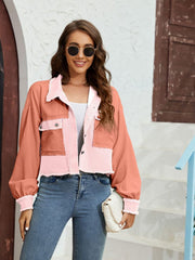 Cropped colorblock jacket in pink and coral with raw edges and button pockets.