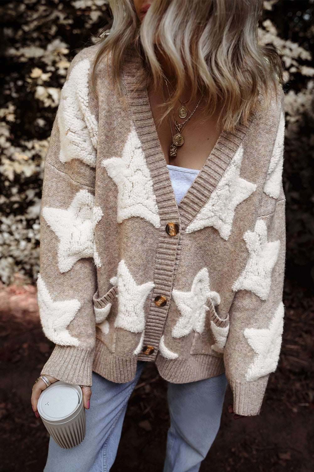 Textured starburst knit cardigan in mocha with button front and pockets.