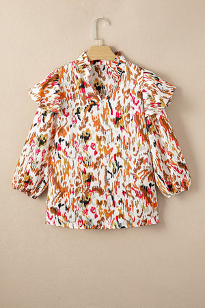 Ruffled Aura Sleeve Blouse in abstract print with ruffled neckline and balloon sleeves.