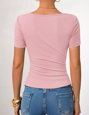 Pink maternity t-shirt with short sleeves and a fitted silhouette, showing the back detail.