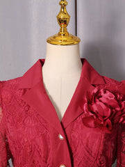 Red lace midi dress with button placket, collared neckline, and a large fabric flower detail.