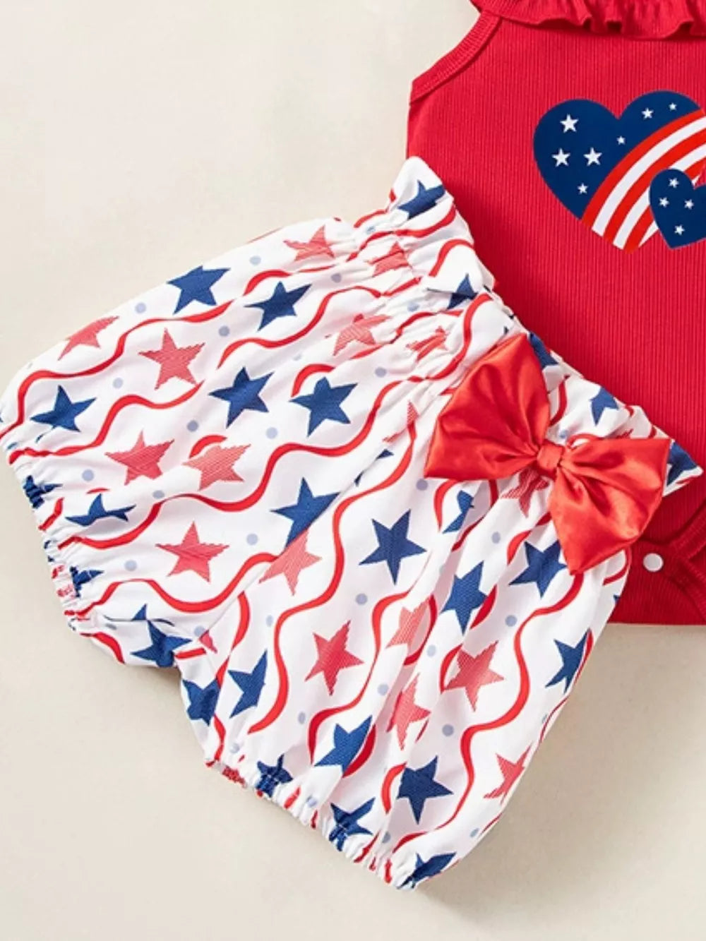 Red patriotic baby set with star print bloomer shorts and bow detail