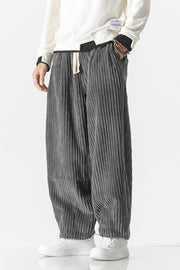 Gray corduroy wide-leg cargo pants with a relaxed fit and drawstring waist.