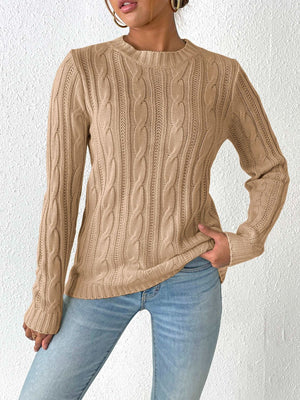 Camel cable knit sweater with crew neck and long sleeves.
