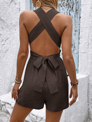 Brown sleeveless romper with crisscross back and tie waist