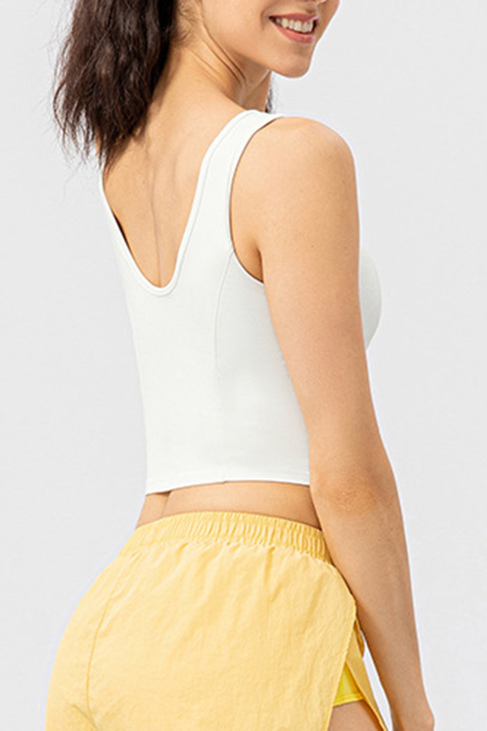 White active crop top with sculpted seams and a U-neckline.