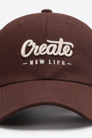 Burnt Umber baseball cap with embroidered "Create New Life" text.