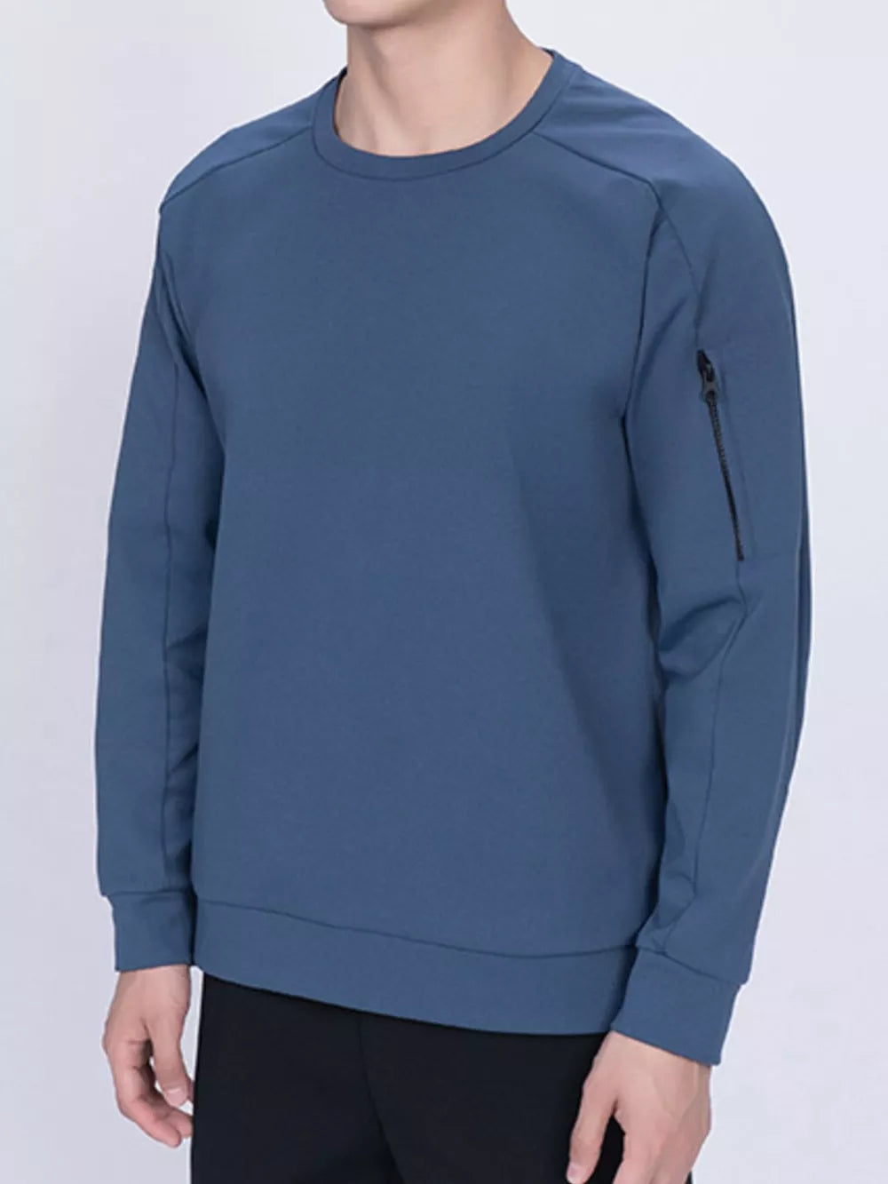 Dusty blue zippered sweatshirt with crew neck and zippered sleeve pocket.