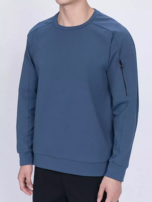 Dusty blue zippered sweatshirt with crew neck and zippered sleeve pocket.