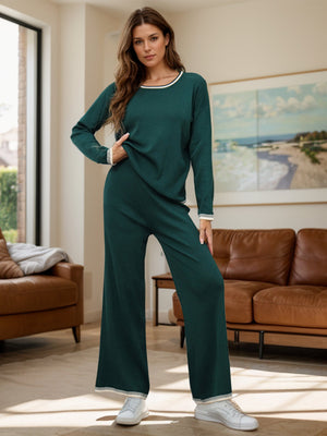 Dark green acrylic sweater set with contrast trim, crew neck, long sleeves, and wide-leg pants.