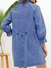 Dusty blue denim button-down dress with ruffled cuffs and pleats.