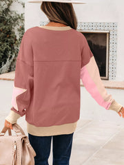 Dusty pink sweatshirt with star patchwork on sleeve and contrast stitching.