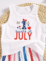 White baby tank top with "my 1st Fourth of July" graphic and striped shorts