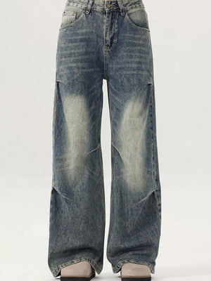 Men's vintage-inspired wide-leg jeans in distressed blue denim with a baggy fit.