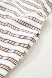 Casual striped mini dress with pockets in cotton, featuring red, blue, and dark stripes on a cream background.