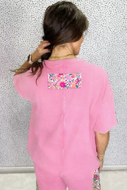 Pink cotton tunic t-shirt with floral patch detail on back.
