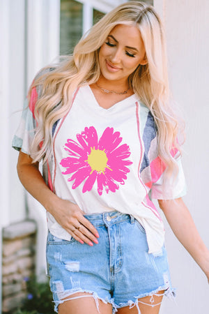 White t-shirt with pink floral graphic and colorblock sleeves