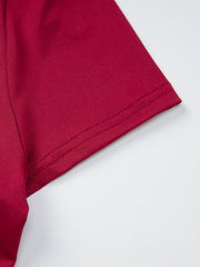 Fitted one-shoulder t-shirt in deep red with double-stitched hem detail.