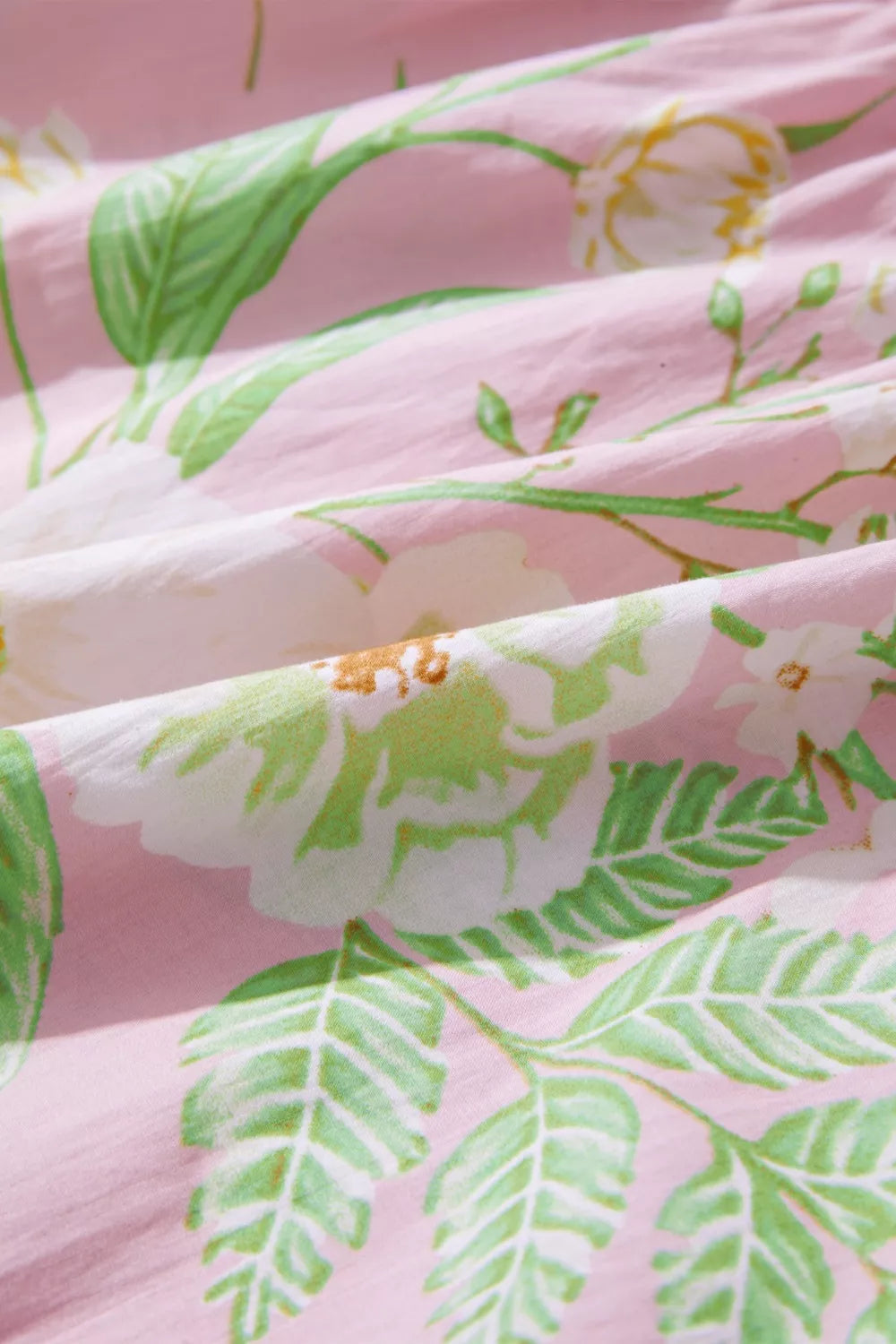 Pink floral cotton dress with puff sleeves and tiered skirt detail