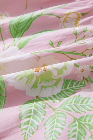 Pink floral cotton dress with puff sleeves and tiered skirt detail