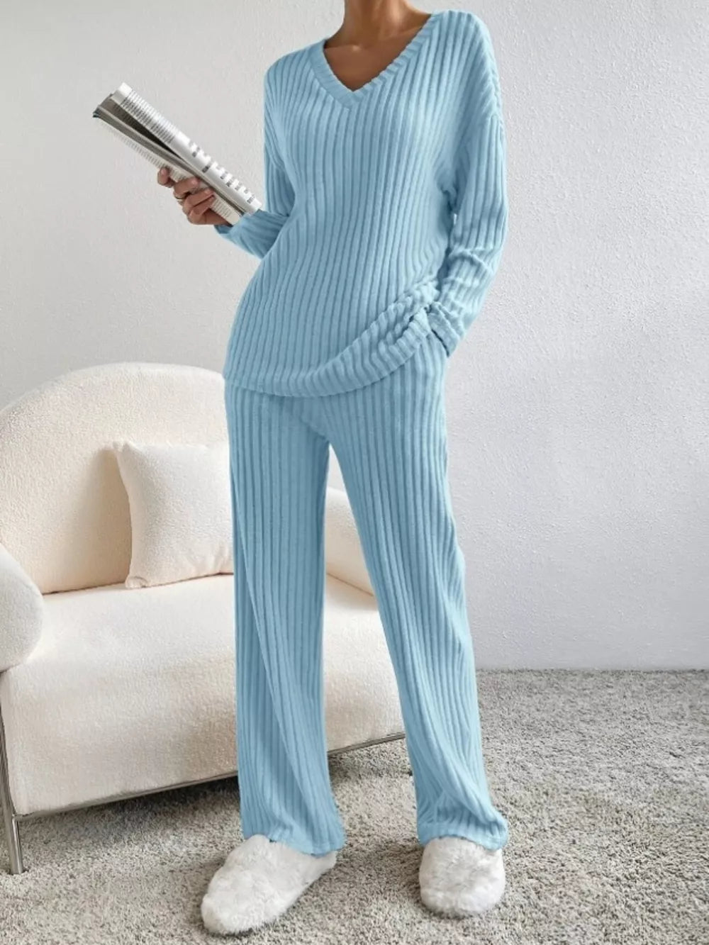 Blue ribbed knit V-neck loungewear set with long sleeves and wide-leg pants.