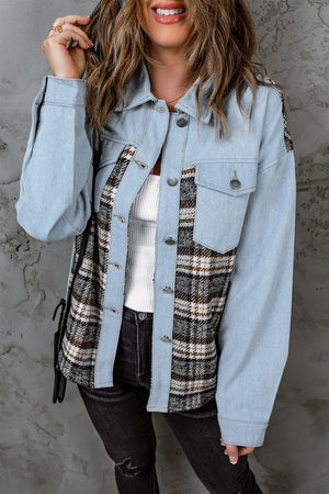 Light blue denim shirt jacket with plaid panels and button front.