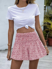 Charming floral elastic waist shorts in red with a smocked waistband and a-line cut.