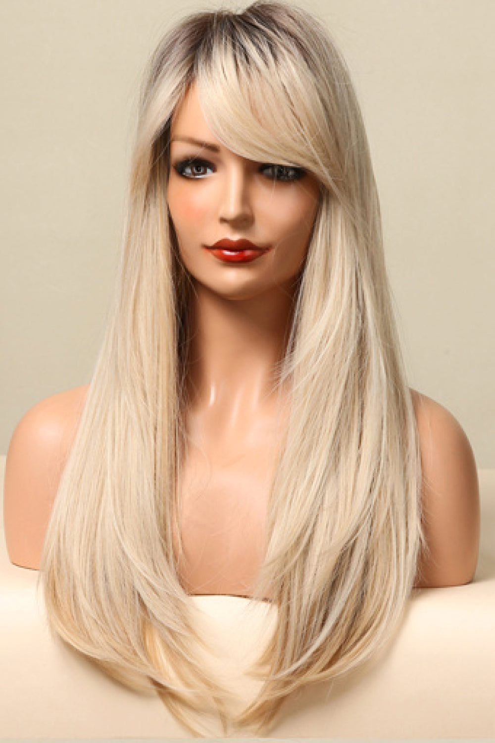 Ombre blonde long wig with side bangs and layered cut.