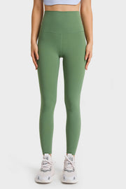 Green high rise leggings with a seamless waistband and full length legs.