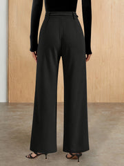 Black flared leg trousers with chain detail and belt loops.