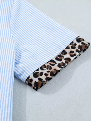 Blue striped button-down shirt with leopard print cuffs