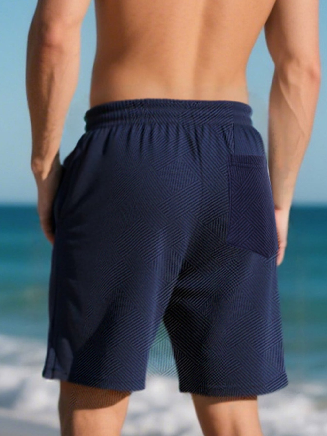 Navy blue chino shorts with geometric pattern and drawstring waist.