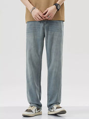 Relaxed fit wide-leg denim trousers in light blue, styled casually.