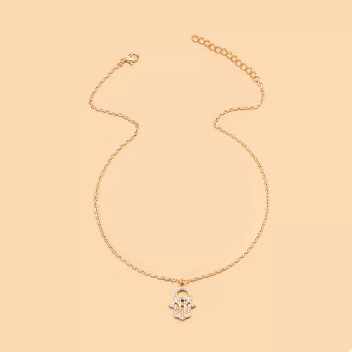 Gold evil eye hamsa pendant necklace with rhinestone details