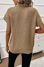 Khaki textured knit turtleneck cap sleeve sweater with a diamond pattern.