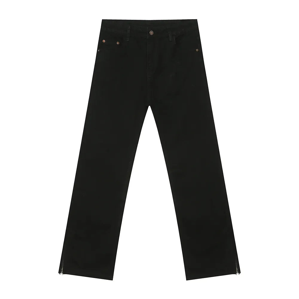 Black denim jeans with a split hem detail