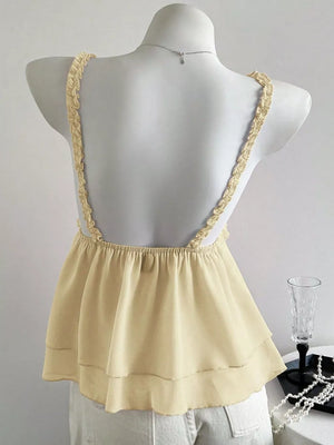 Light yellow layered cami with ruffled lace straps and a tiered hem.