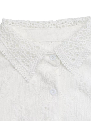 White lace-trimmed button-up maternity shirt with textured fabric and ruffle sleeves.