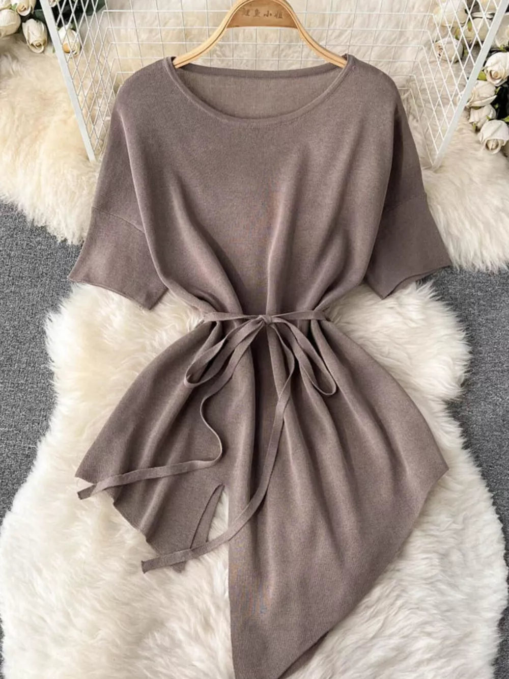 Tied waist knit set in khaki with wide legs and asymmetric hem.