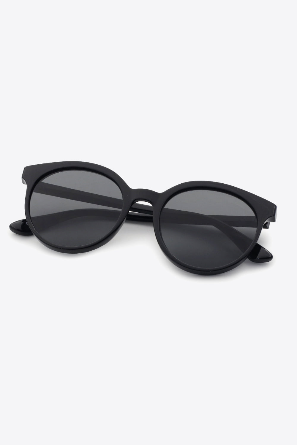 Black round frame sunglasses with dark lenses