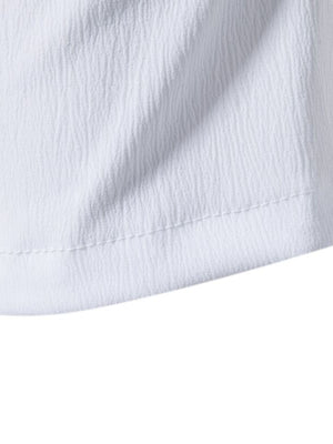 White cotton undershirt with textured fabric and visible stitching detail.
