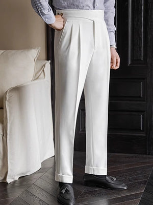 White pleated wide-leg dress pants with cuffed hem and a classic fit.