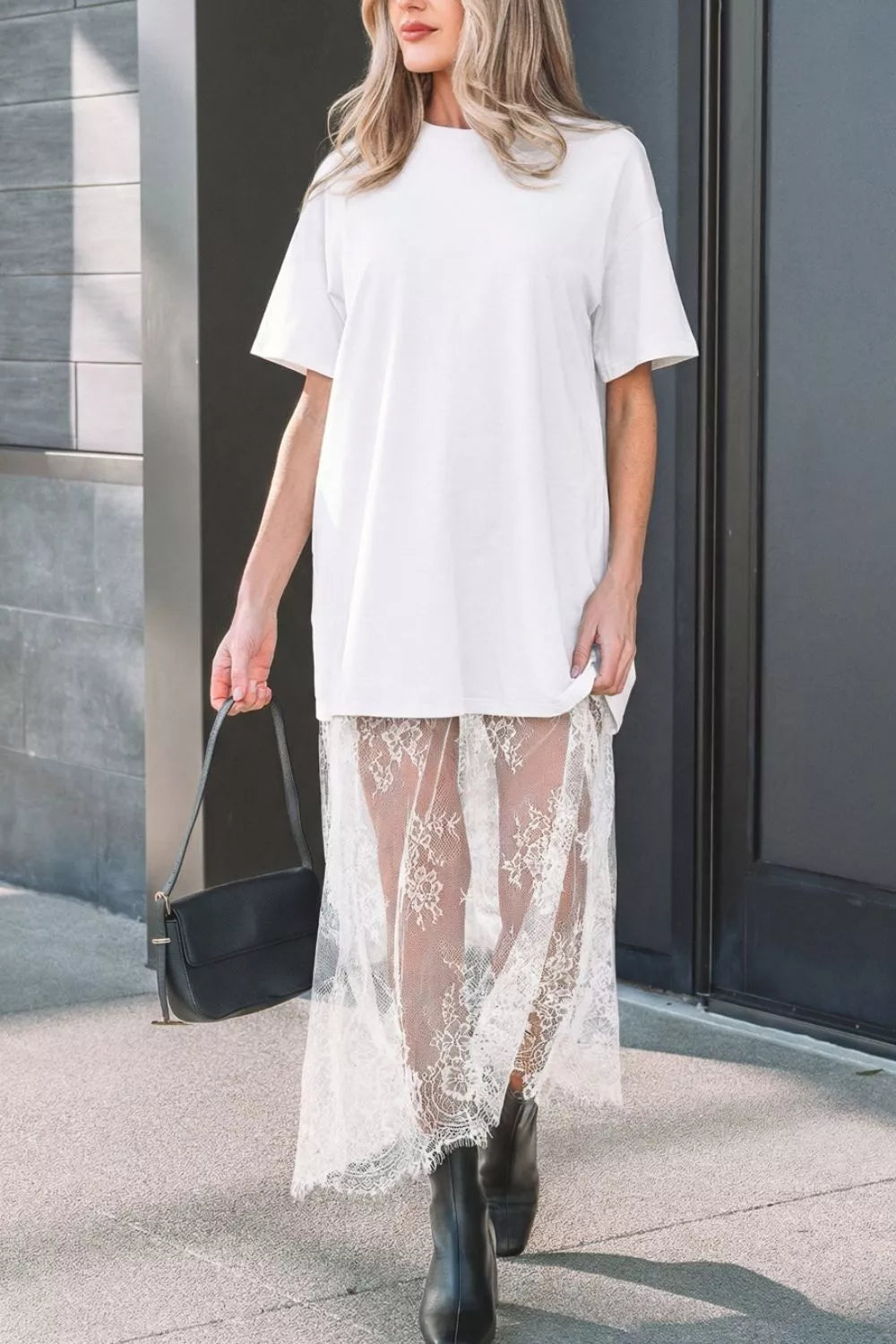 White cotton midi t-shirt dress with sheer lace overlay skirt and short sleeves.