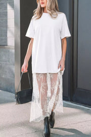 White cotton midi t-shirt dress with sheer lace overlay skirt and short sleeves.
