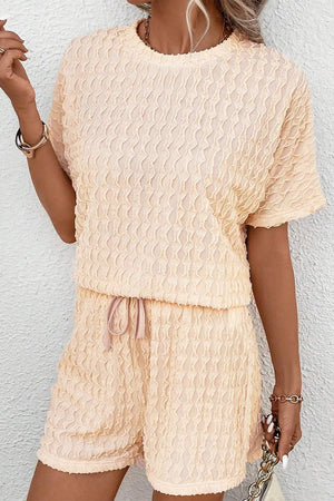 Pastel yellow textured wave co-ord lounge set with drawstring shorts and short sleeve top.