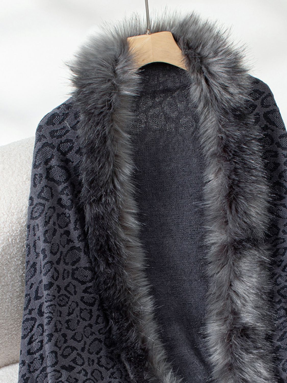 Leopard print cardigan with faux fur trim in black and grey acrylic.