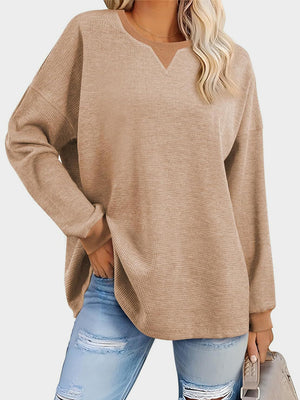 Tan waffle knit raglan sleeve sweatshirt with V-neck detail and cuffed sleeves.