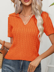 Orange cable-knit short sleeve polo sweater with a V-neck.