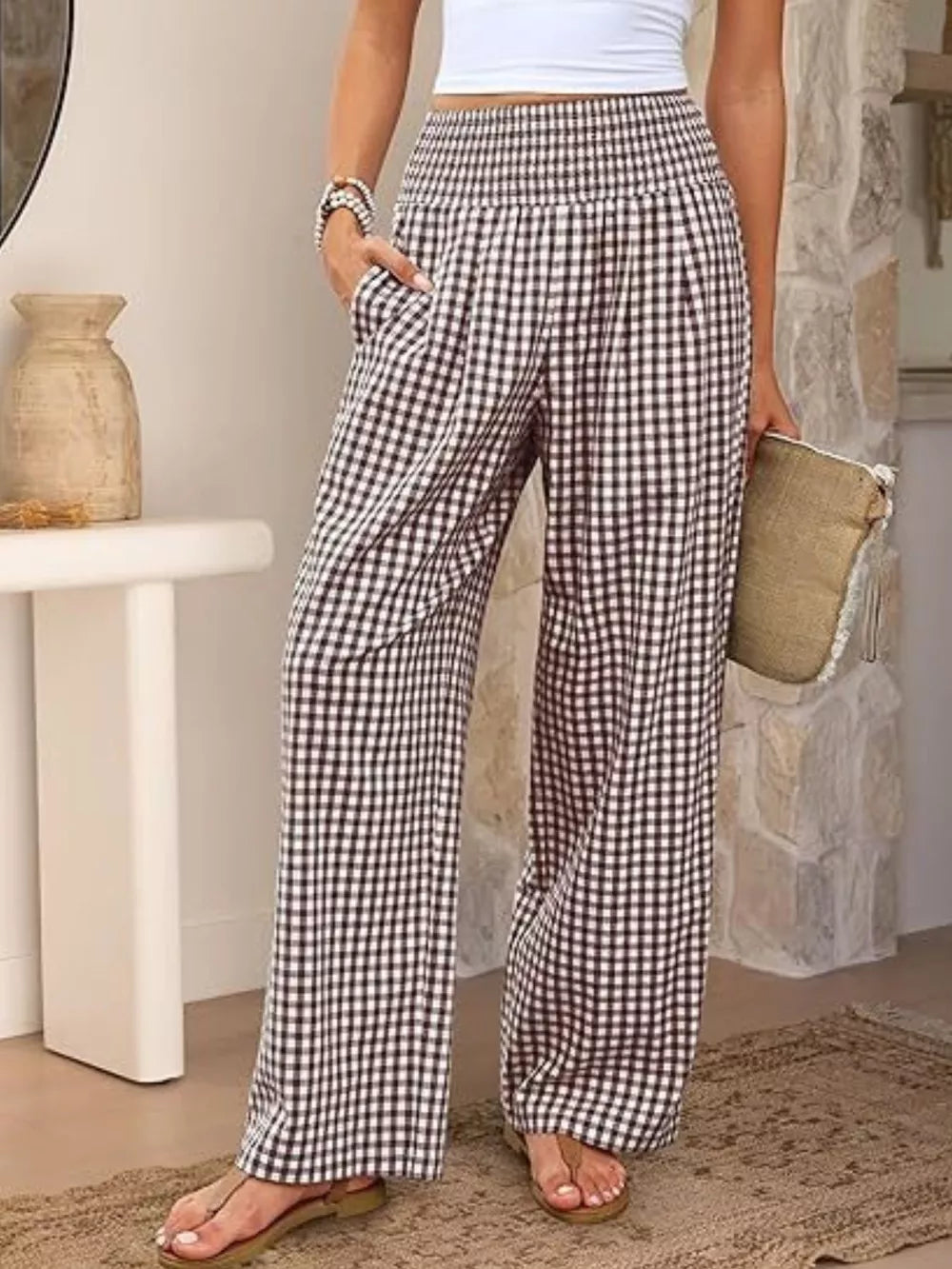 Black plaid gingham maternity pants with smocked waistband and wide legs.